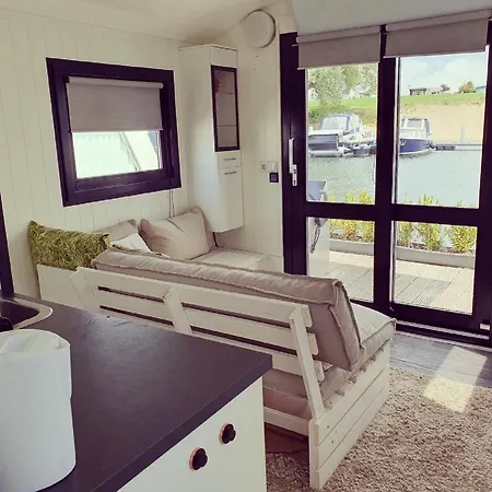 Botel Houseboat In Lathumse Plas With Harbor Views Lathum