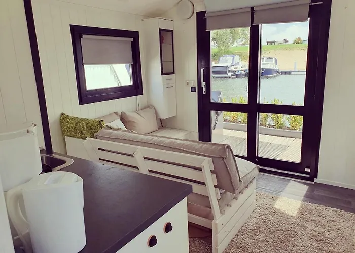 Botel Houseboat In Lathumse Plas With Harbor Views Lathum